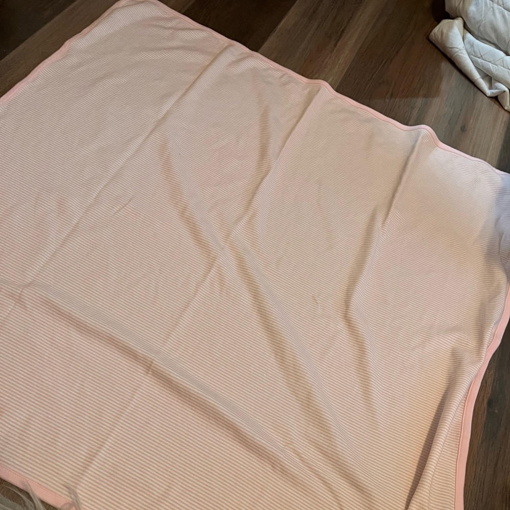 Baby’s pink and white striped Muslim blanket